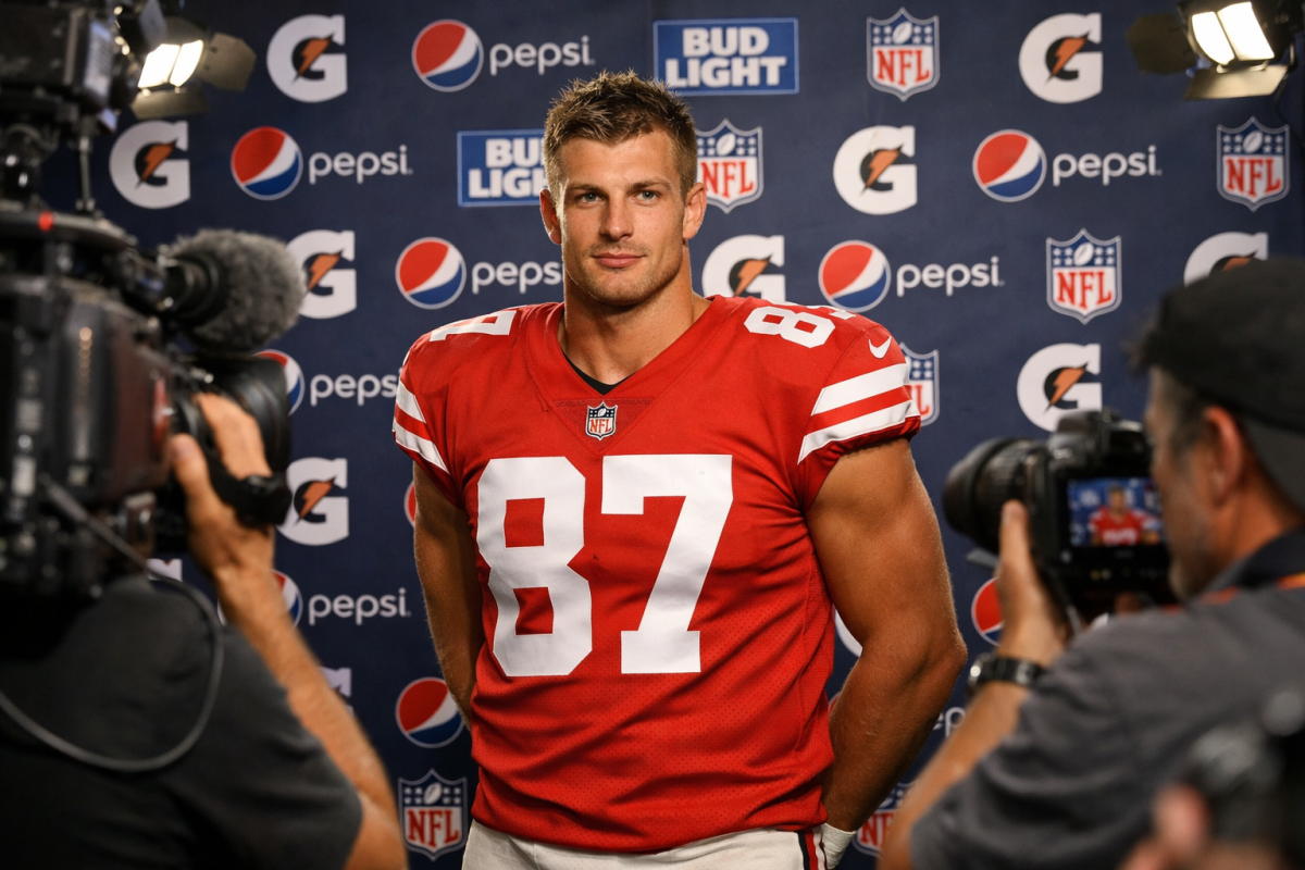 Athletes posing in front of branded banner